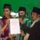 Calon Presiden Republik Indonesia periode 2014-2019, Joko Widodo usai menandatangani kesepakatan untuk menetapkan peringatan Hari Santri Nasional bersama KH Thoriq Bin Ziyad di Malang. Foto: Istimewa